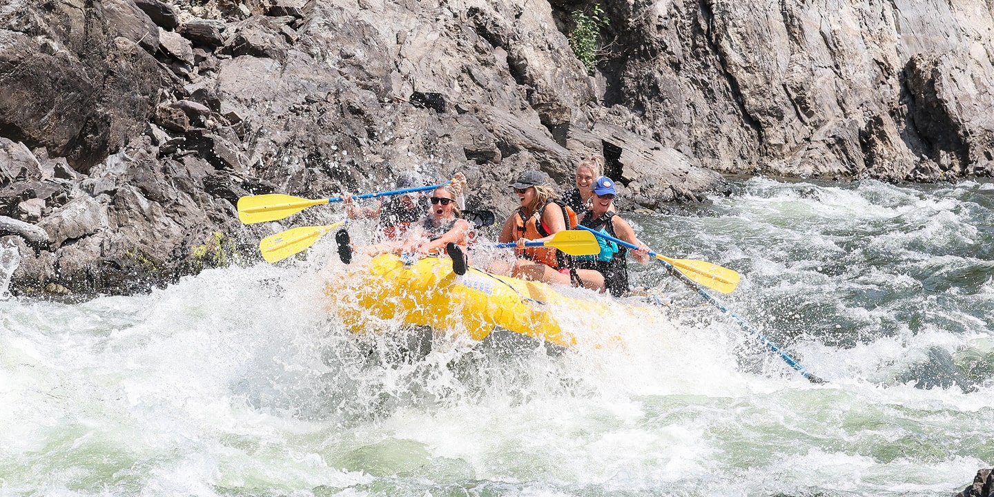 hitting a rapid on clark fork whitewater rafting trip