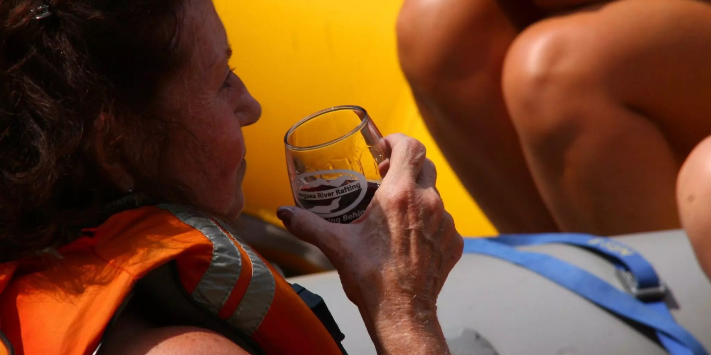 woman enjoys wine tasting and rafting in spokane