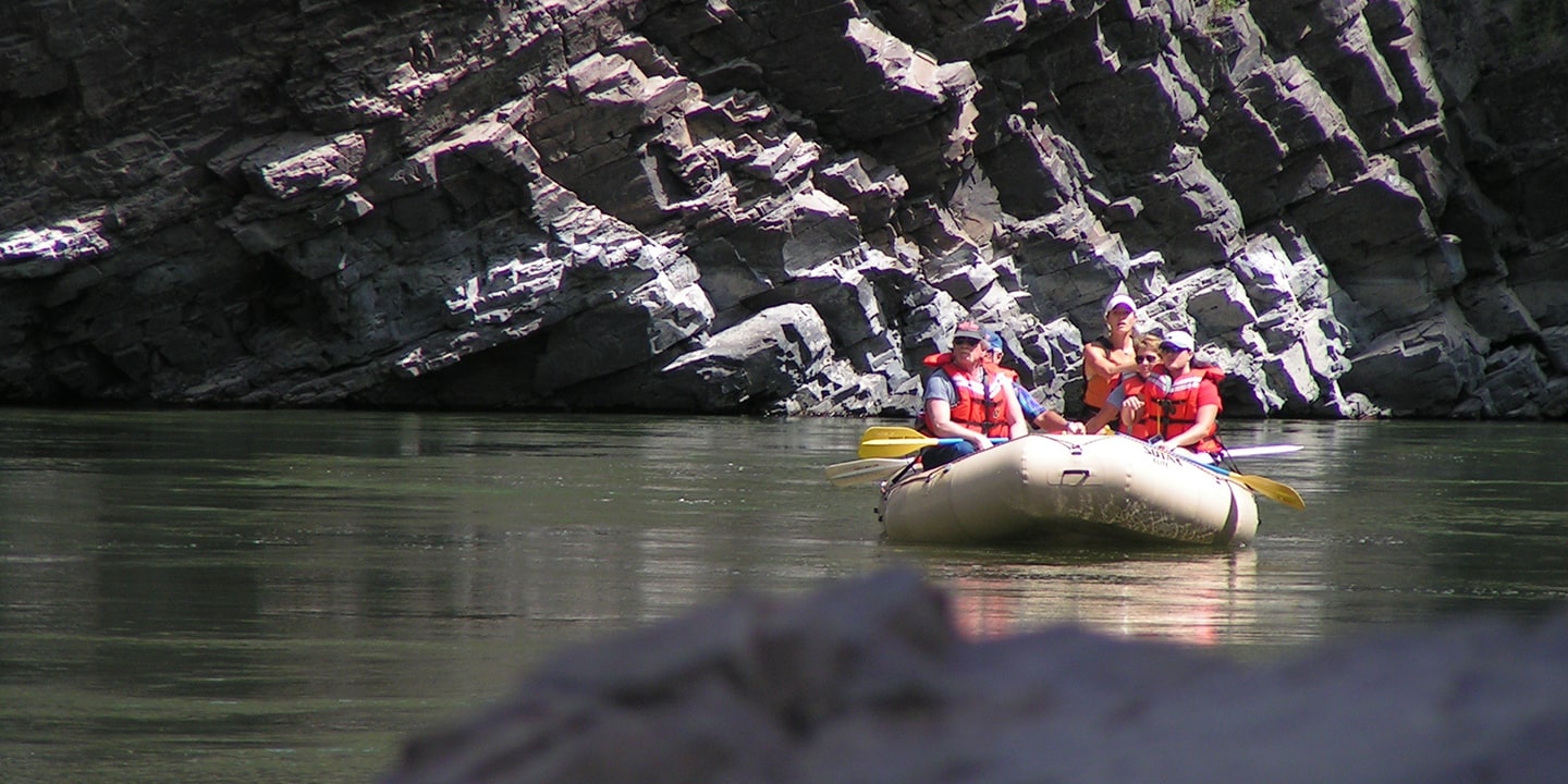 boat and canyons on blackfoot river float trip
