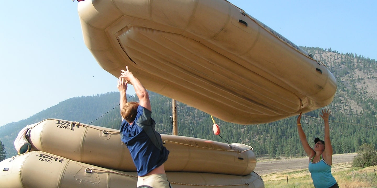 participants lifting raft in guide job training