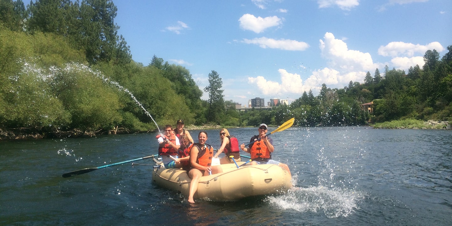 family on spokane river family rafting trip
