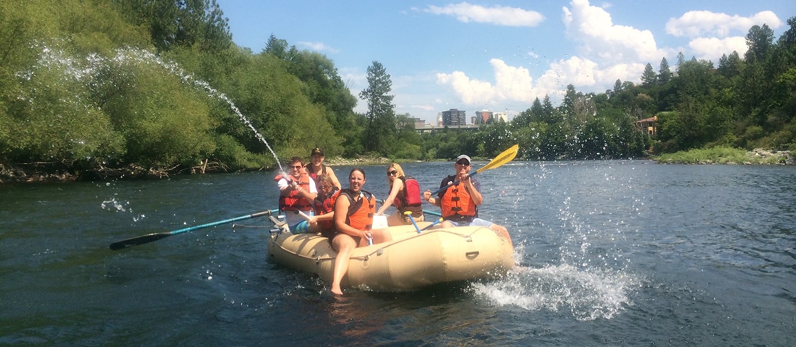 participants pose while spokane river family rafting